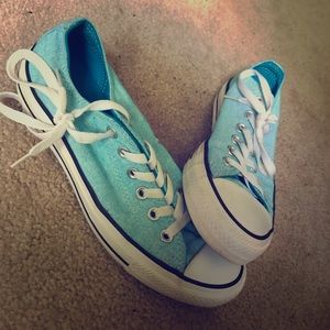 Light blue pair of converse all stars.